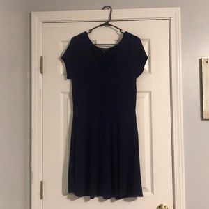 Knee length blue patterned dress.